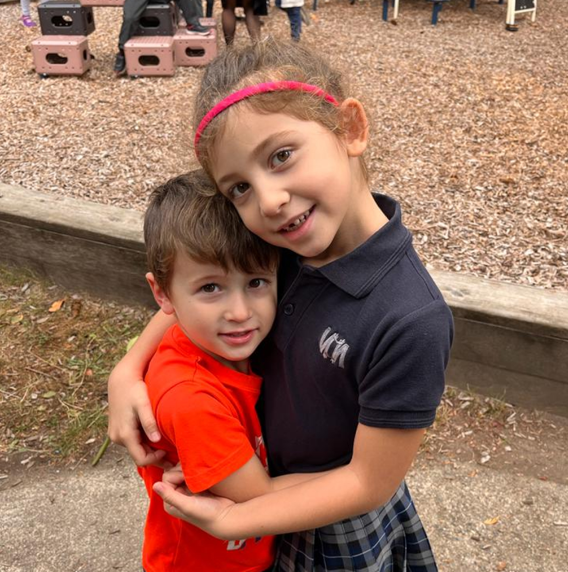 Kids hugging on playground